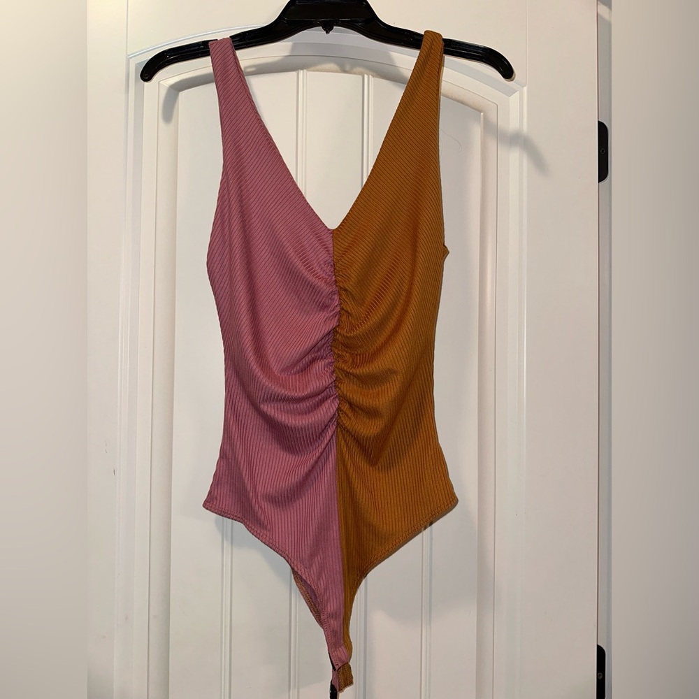 pink and orange body suit